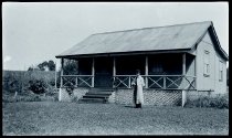 Father Victorinus Claesen, SS.CC., in front of the rectory of Saint Sylvester Church, Kilauea, Kauai.